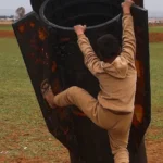 Verifying Viral Photo: Child Climbs Real Missile Booster in Syria