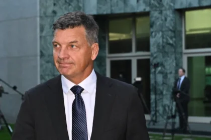 Taylor Ties Migration Cap to New Homes in Budget Reply